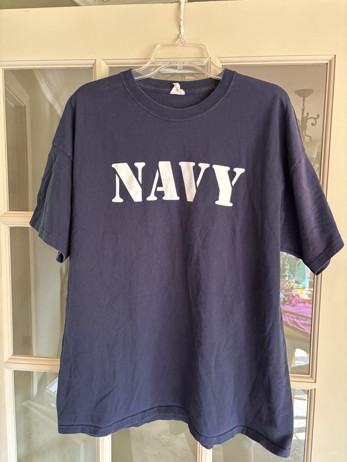United States Navy T and ironically the color is navy with white lettering. XXL