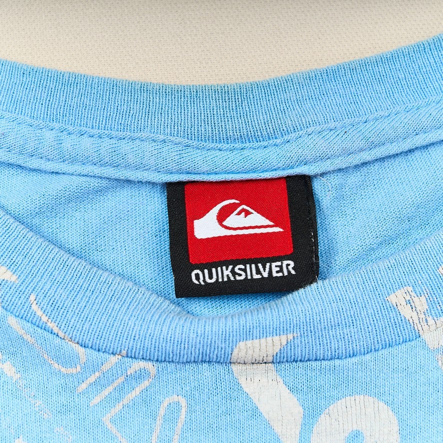 Vintage 90s Quiksilver Graphic T-Shirt Men’s L Blue Wave Logo Wrap Around