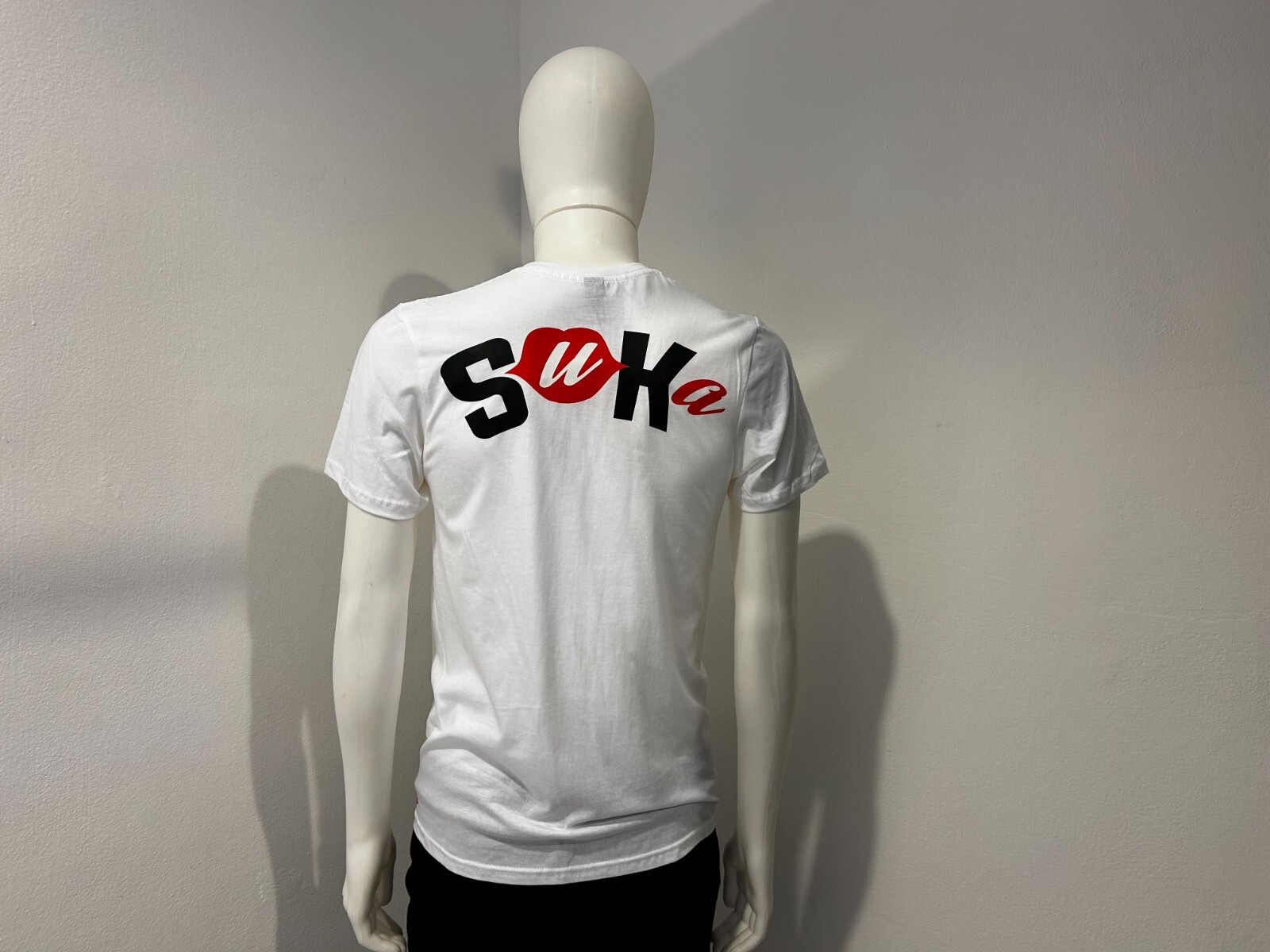Unisex Short Sleeve T-Shirt, White or Black, Brand “Suka” With Logo Back