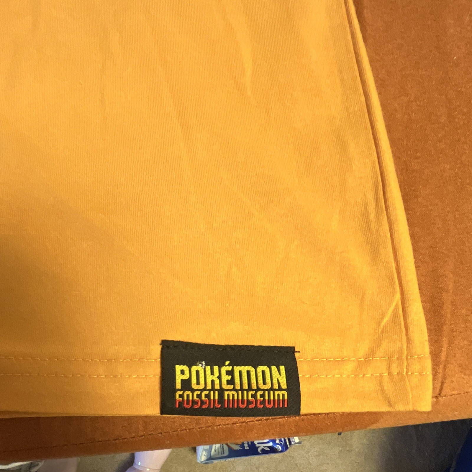 Pokémon Fossil Museum Pikachu Graphic Print Yellow Crew Neck T-Shirt Men L/G