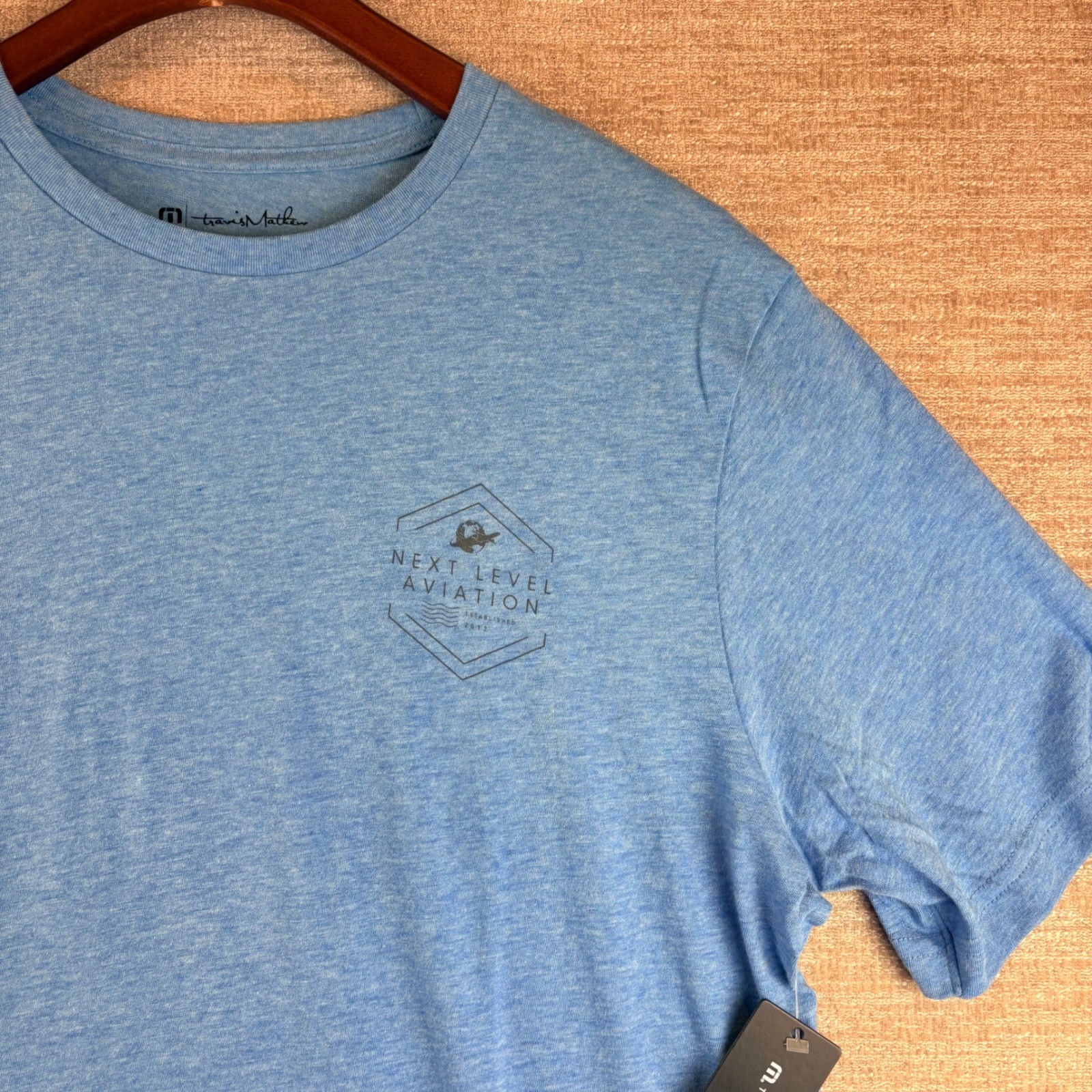 BRAND NEW TravisMathew Heather Blue Next Level Aviation Graphic T-Shirt LG NWT