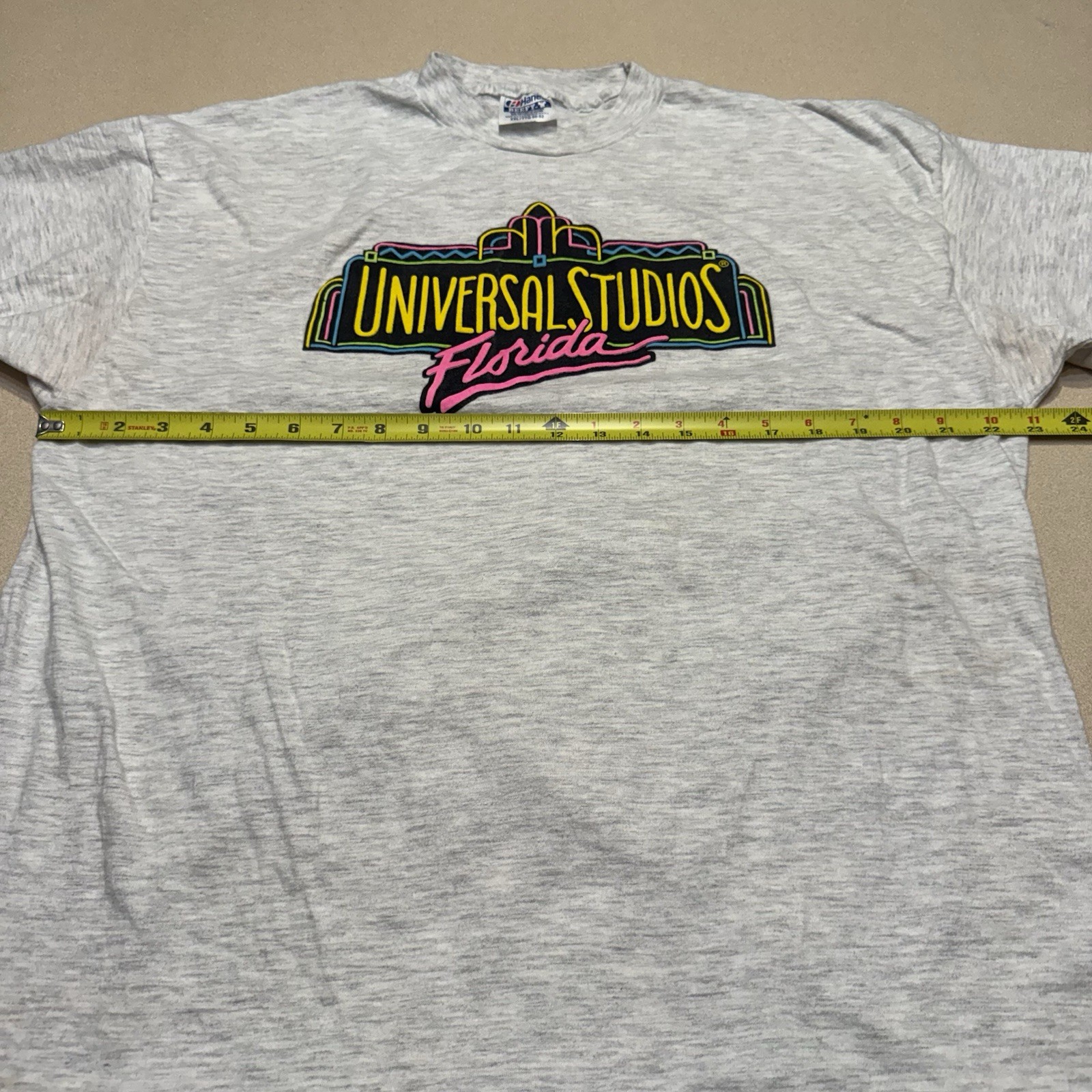 Vintage 90s UNIVERSAL STUDIOS FLORIDA NEON Beefy T-shirt See Pics Spots XXL USA