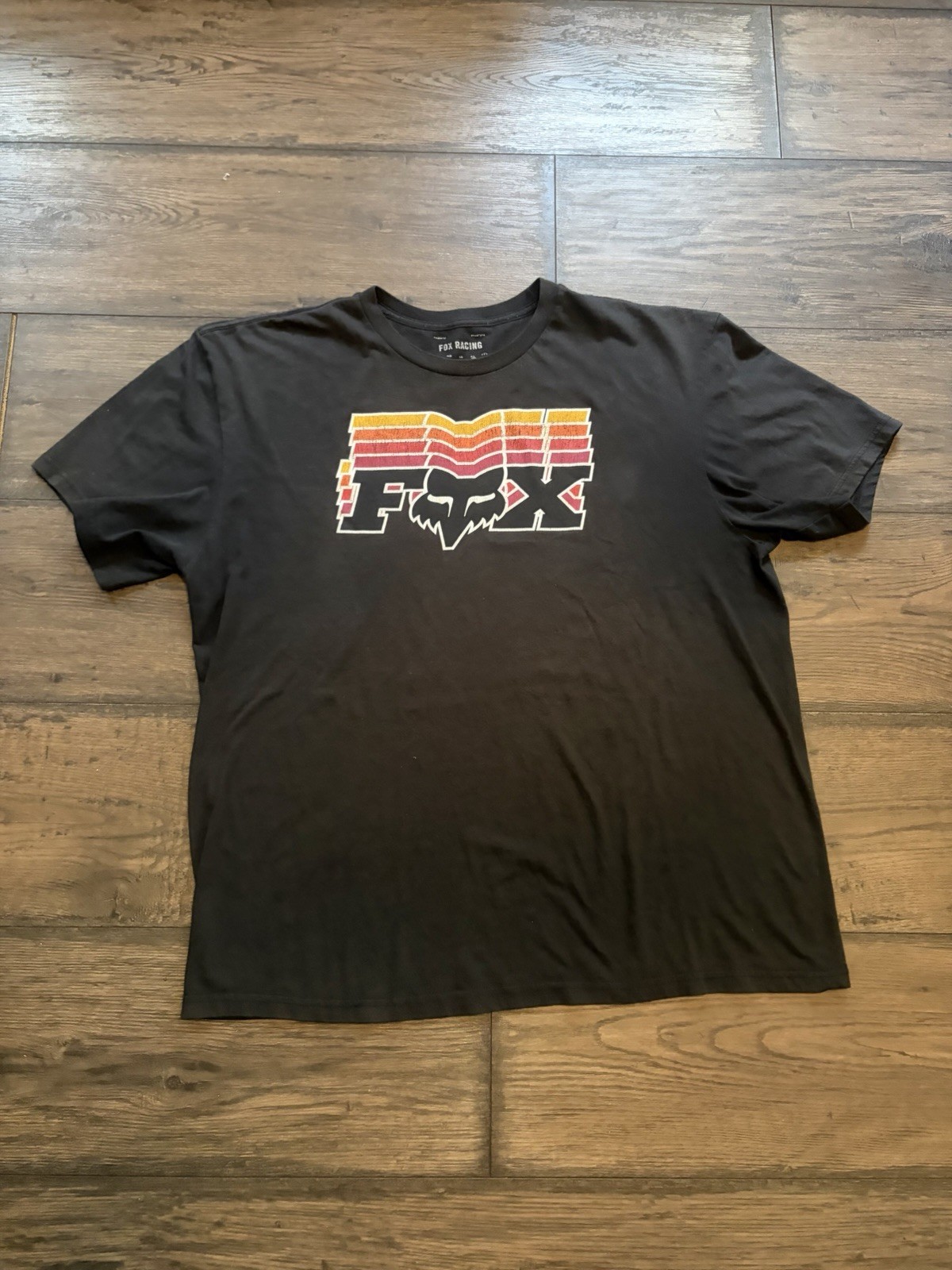 Fox racing off beat tee featuring a colorful graphic logo against a black fabric