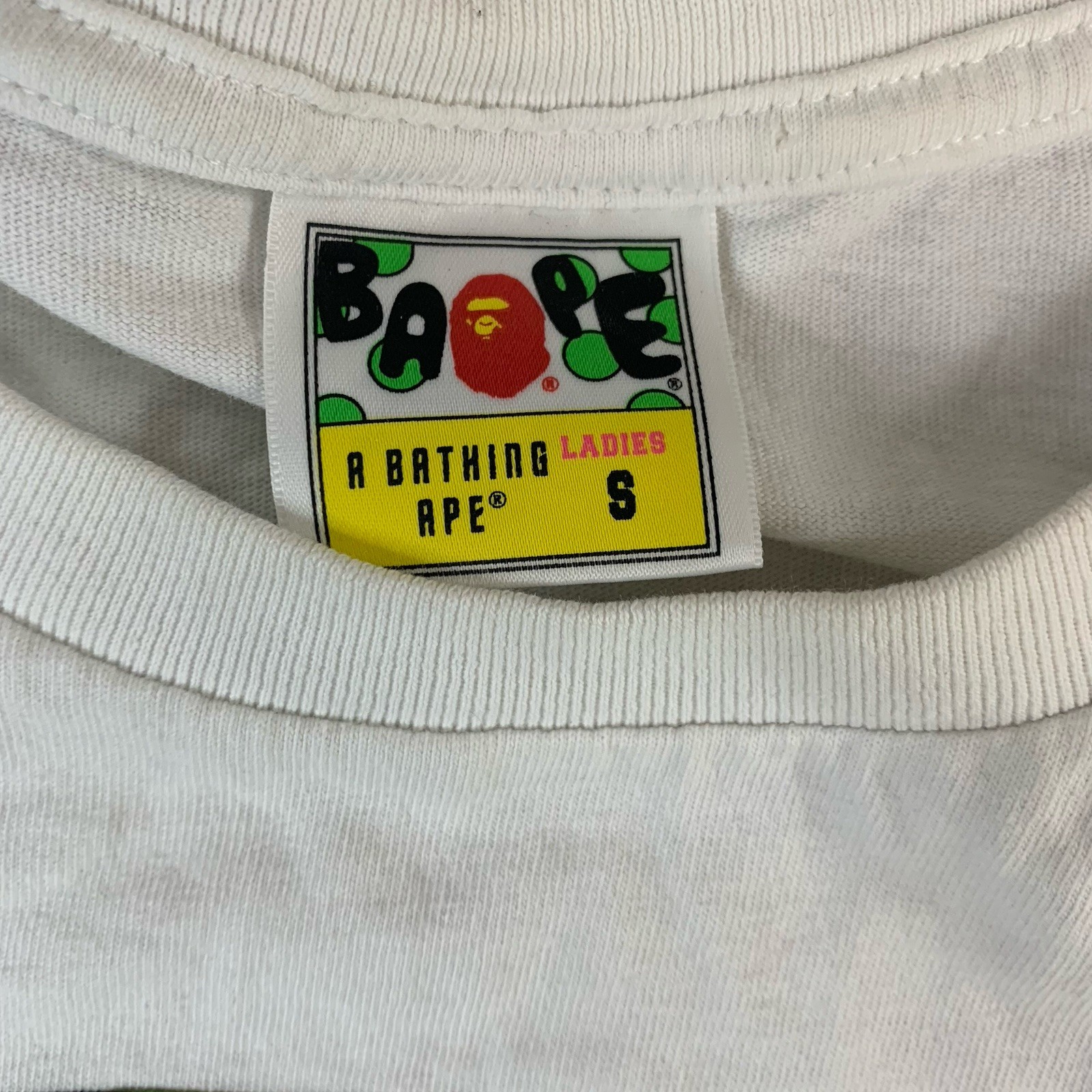 BAPE A Bathing Ape Size 8 Ladies White T-Shirt Green Camo Head