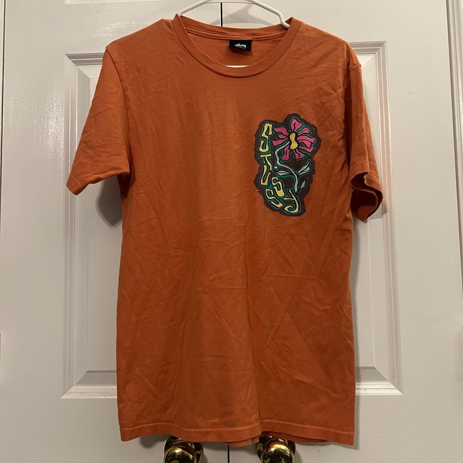 Stussy Flower Graphic Logo Crewneck T-Shirt in Orange