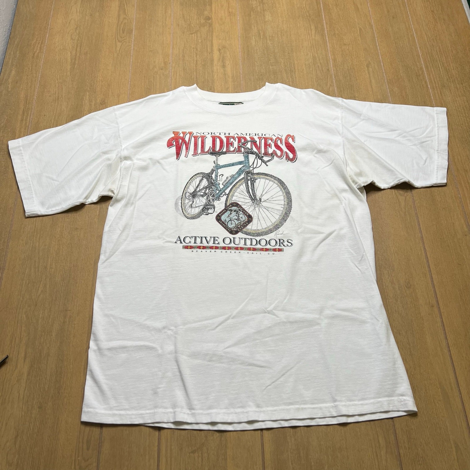 Vintage 90s North American Wilderness T-shirt in white bicycle Outdoors Sz L USA