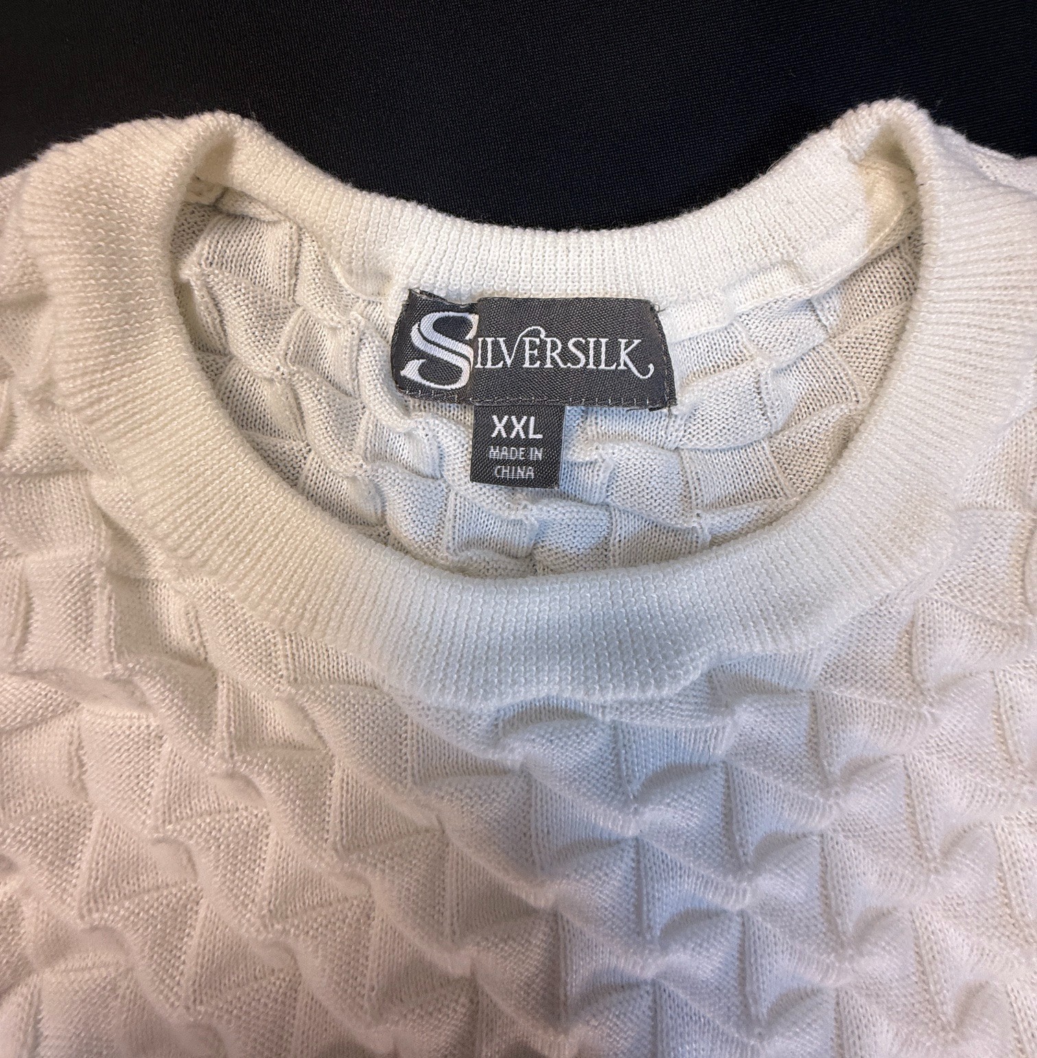 Silversilk textured knit with a raised geometric pattern; white XX (slim)