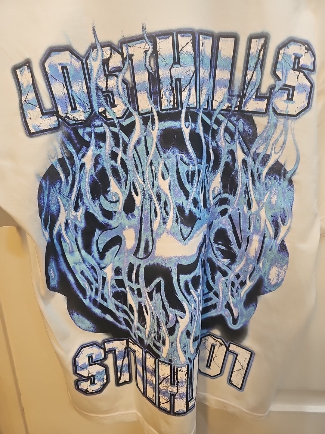 LOST HILLS LOGO FRONT AND MIRROR STYLE LOGO BACK WHITE MEN’S LG (OS) FIRE 🔥 🔥