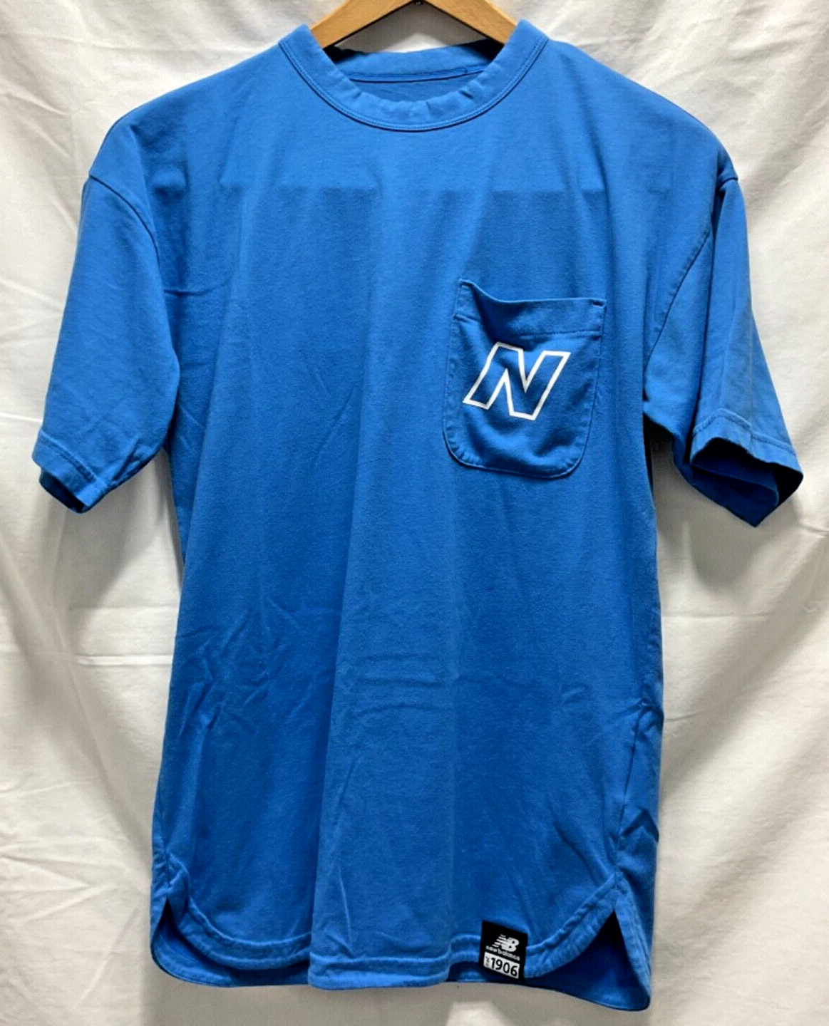 NB New Balance Stretch Blue Pocket T Shirt Unisex size Small Round Slit Hemline