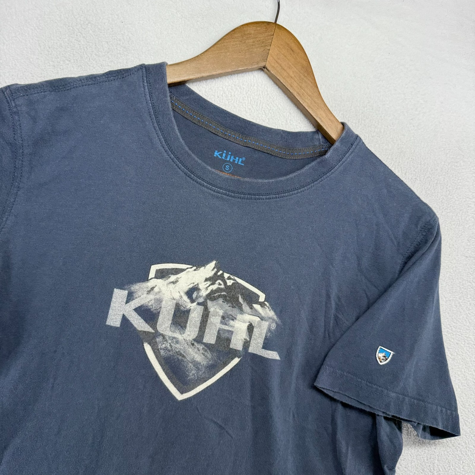 Kuhl Shirt Men’s Small Blue Mountain Graphic Logo Shield Faded Wildfibre Organic