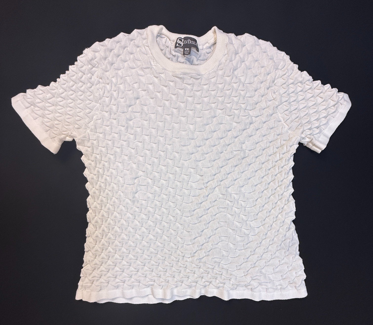 Silversilk textured knit with a raised geometric pattern; white XX (slim)