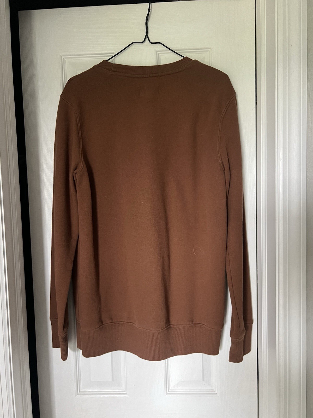 Hand screen printed crew neck “we rise by lifting others” brown medium