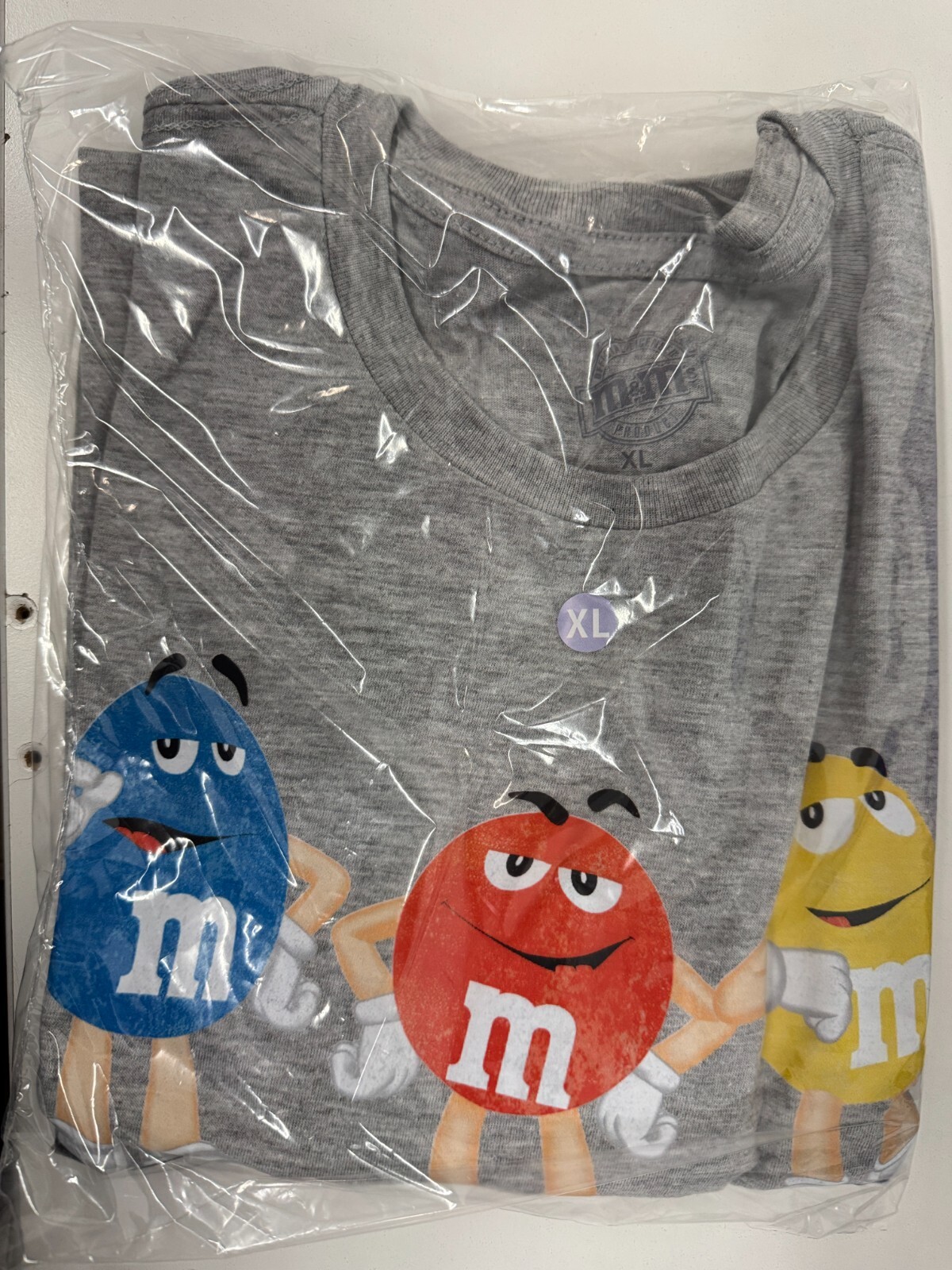 M AND M SURROUNDED BY NUTS GRAPHIC T SHIRT