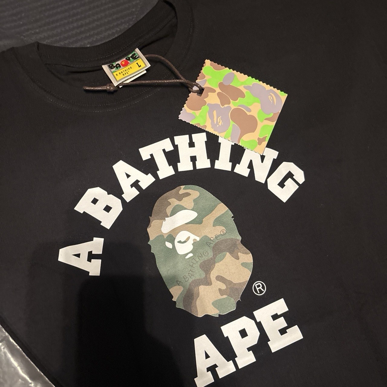 A camo Bathing Ape tee shirt