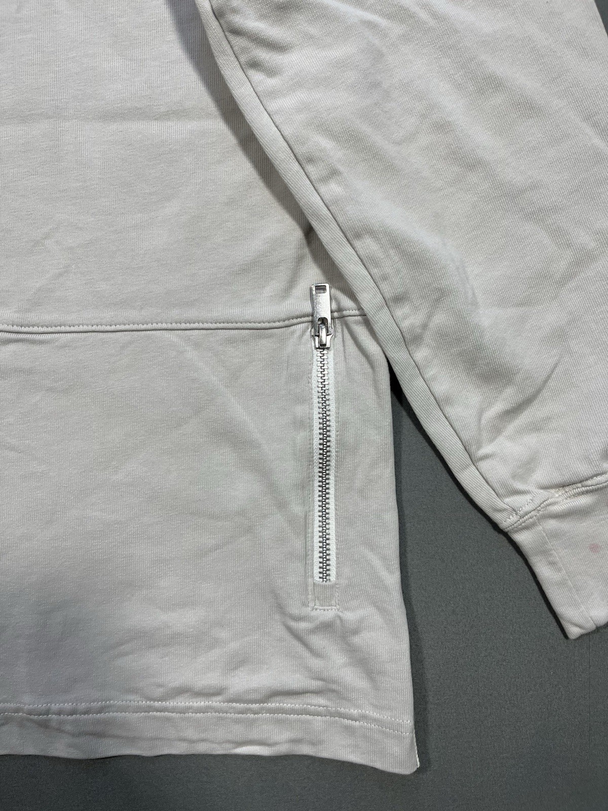 Nike long sleeve mock neck top in Light Bone featuring a small swoosh logo