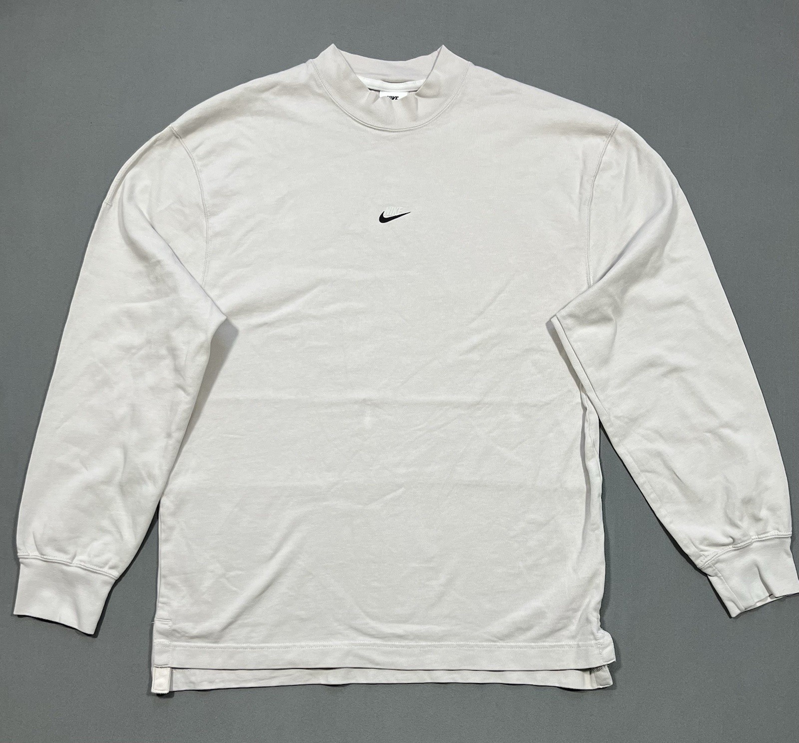 Nike long sleeve mock neck top in Light Bone featuring a small swoosh logo