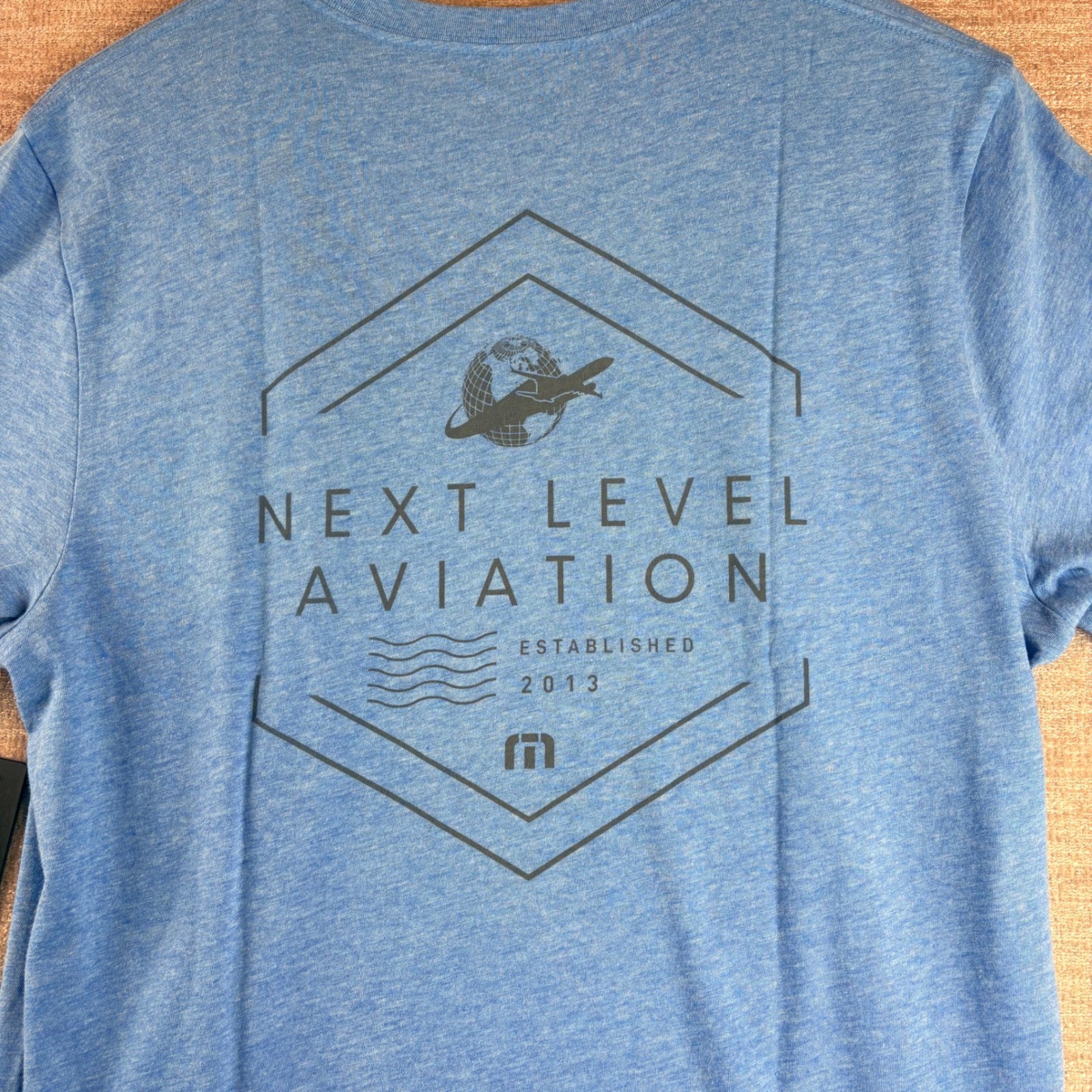 BRAND NEW TravisMathew Heather Blue Next Level Aviation Graphic T-Shirt LG NWT
