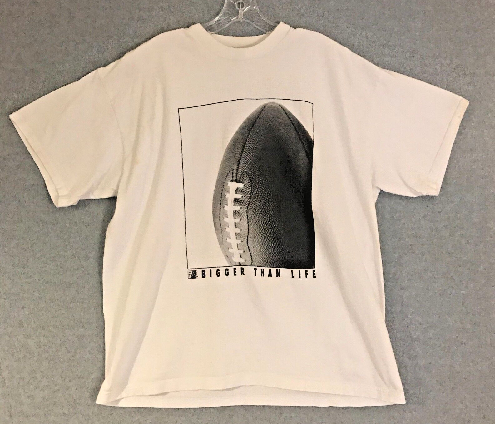 Football “Bigger Than Life” T-Shirt Mens 2XL White Short Sleeve Fabric Art Tee
