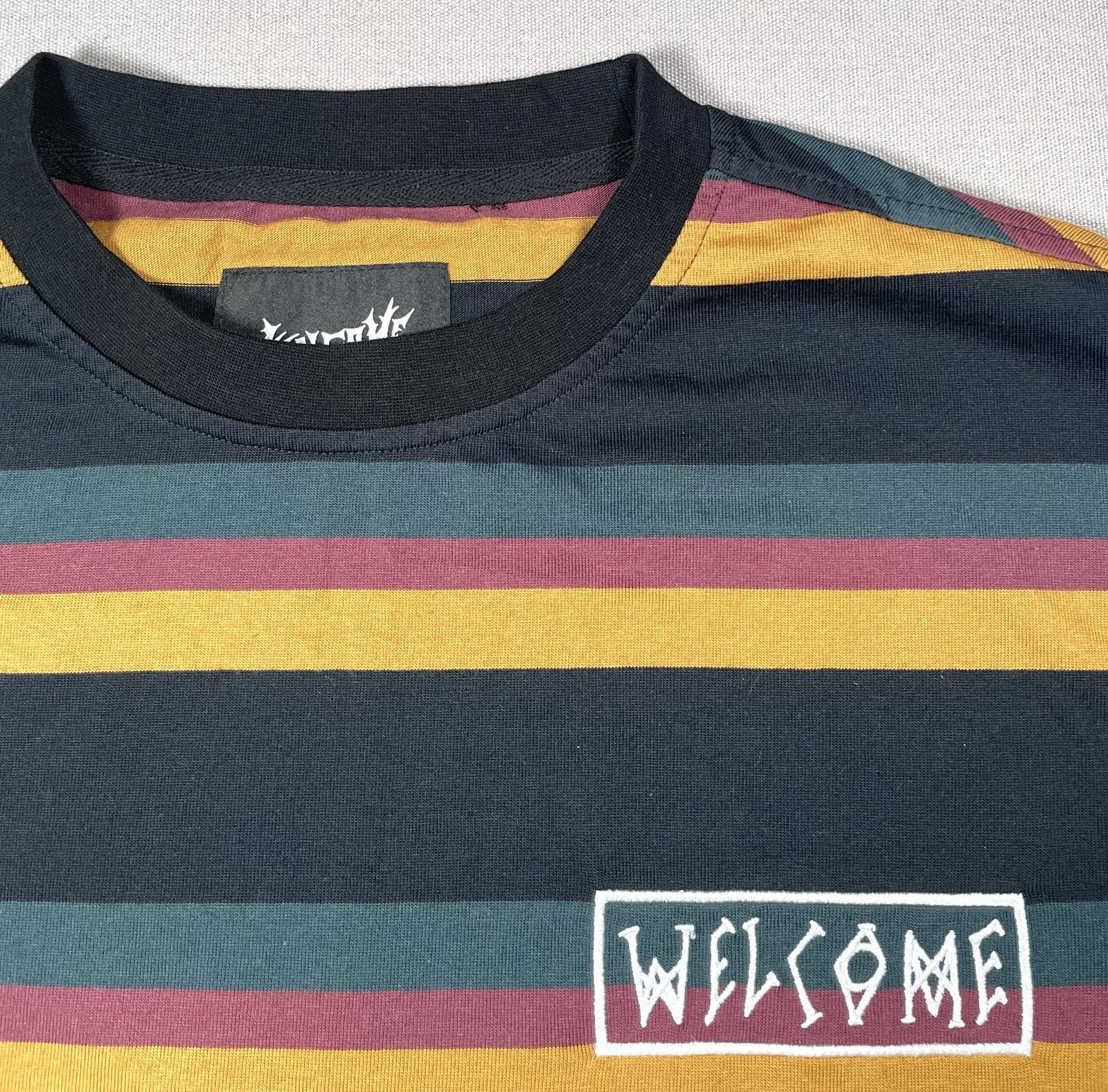 Welcome Skateboards Medius Multi Colored Black Stripe Tee Shirt- Men Size Medium