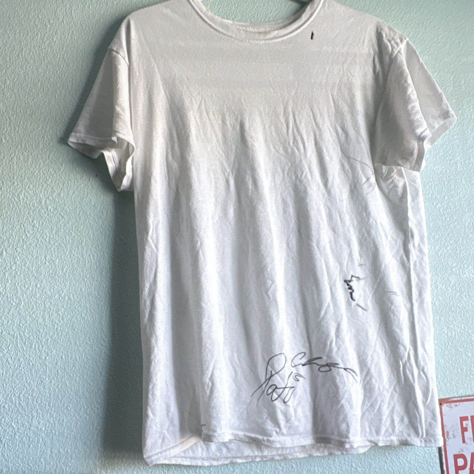 White shirt with Pato O’Wards signature and other Indycar drivers ￼