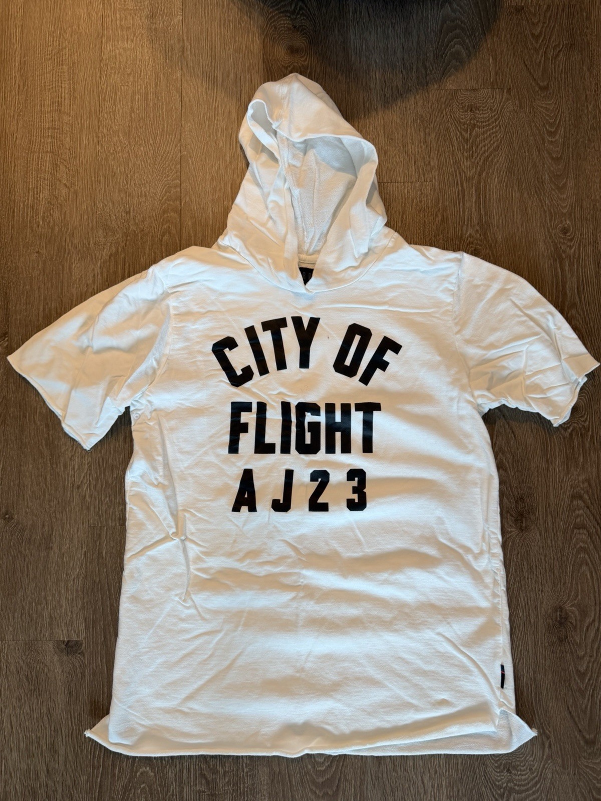 Nike Air Jordan “City of Flight AJ23” Men’s Short-Sleeve Hooded T-Shirt — White