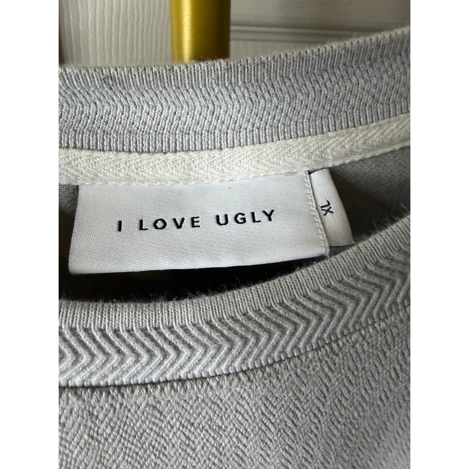 I Love Ugly oversized t-shirt with a textured herringbone pattern.