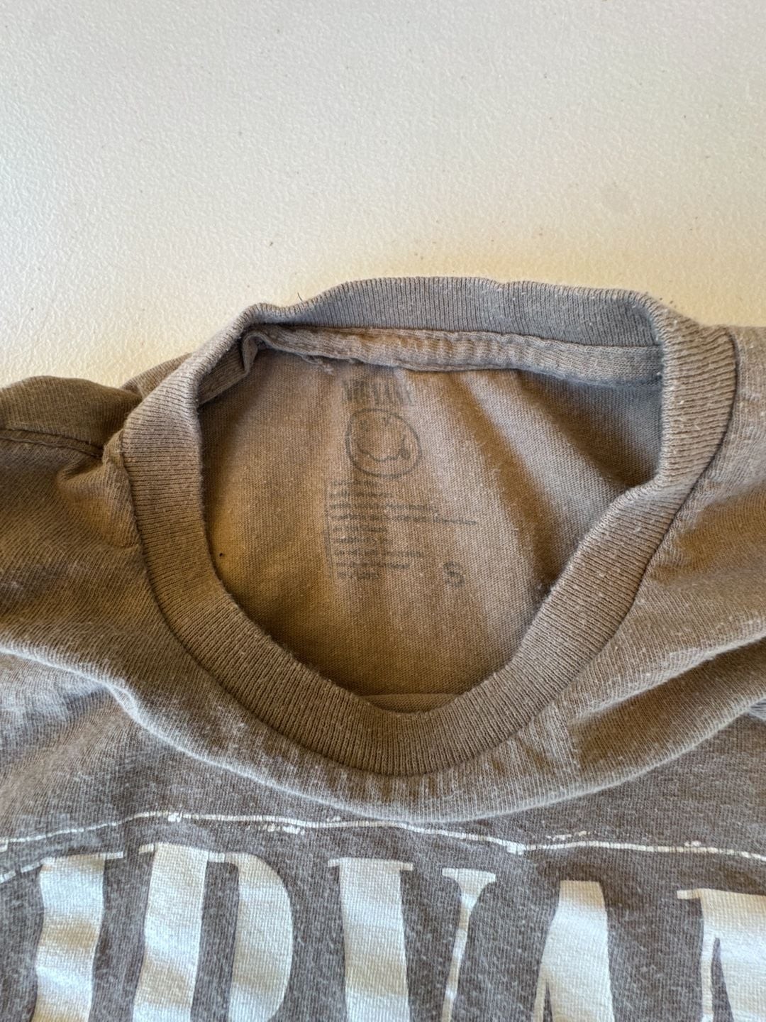 Nirvana Brown Two-Sided Graphic T-Shirt Stencil Logo Smiley Face. Reprint with a