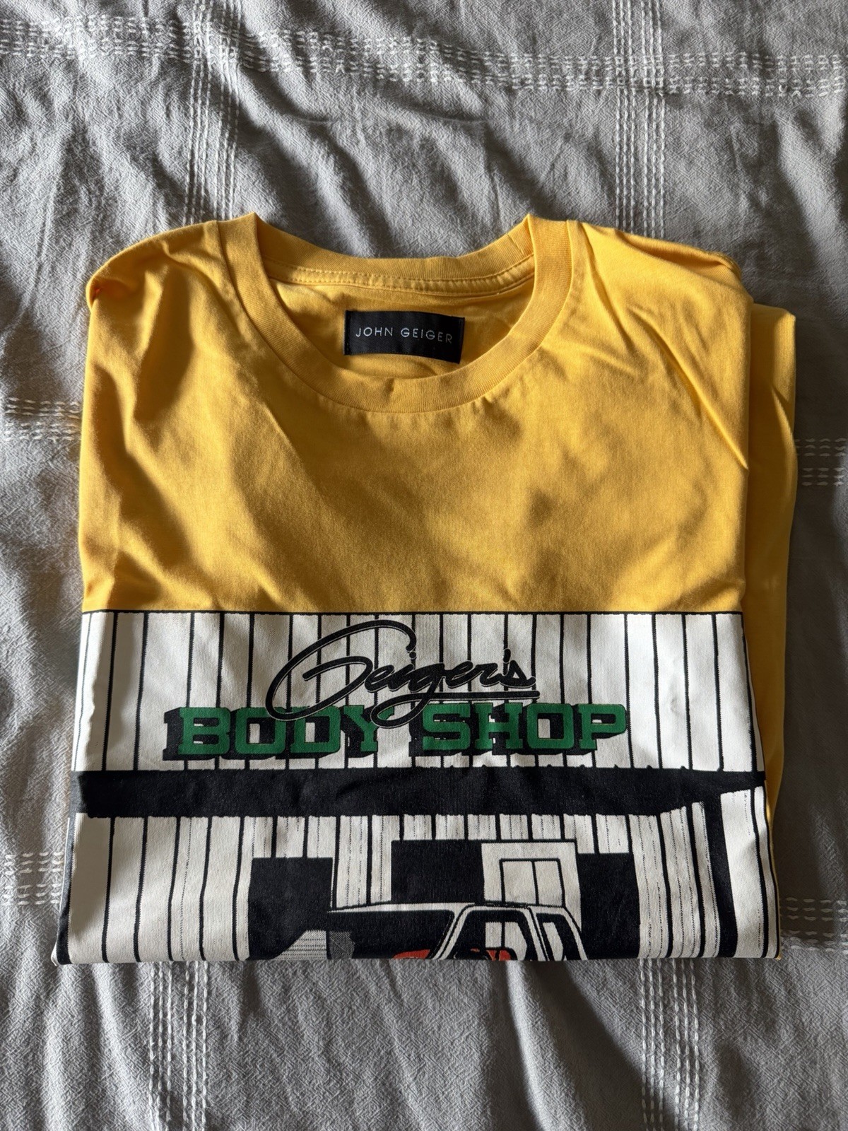 John Geiger Designer Men’s Body Shop T-Shirt, Yellow, Brand New, Never Worn