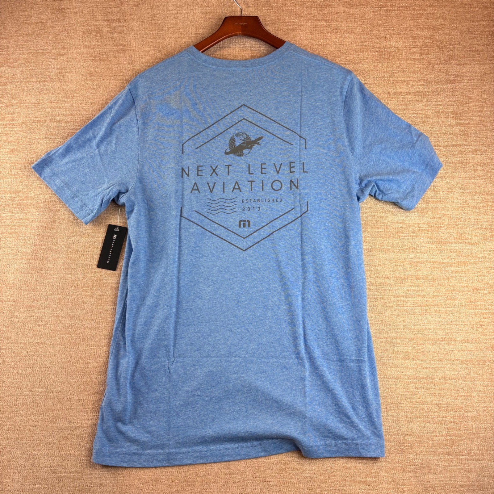 BRAND NEW TravisMathew Heather Blue Next Level Aviation Graphic T-Shirt LG NWT