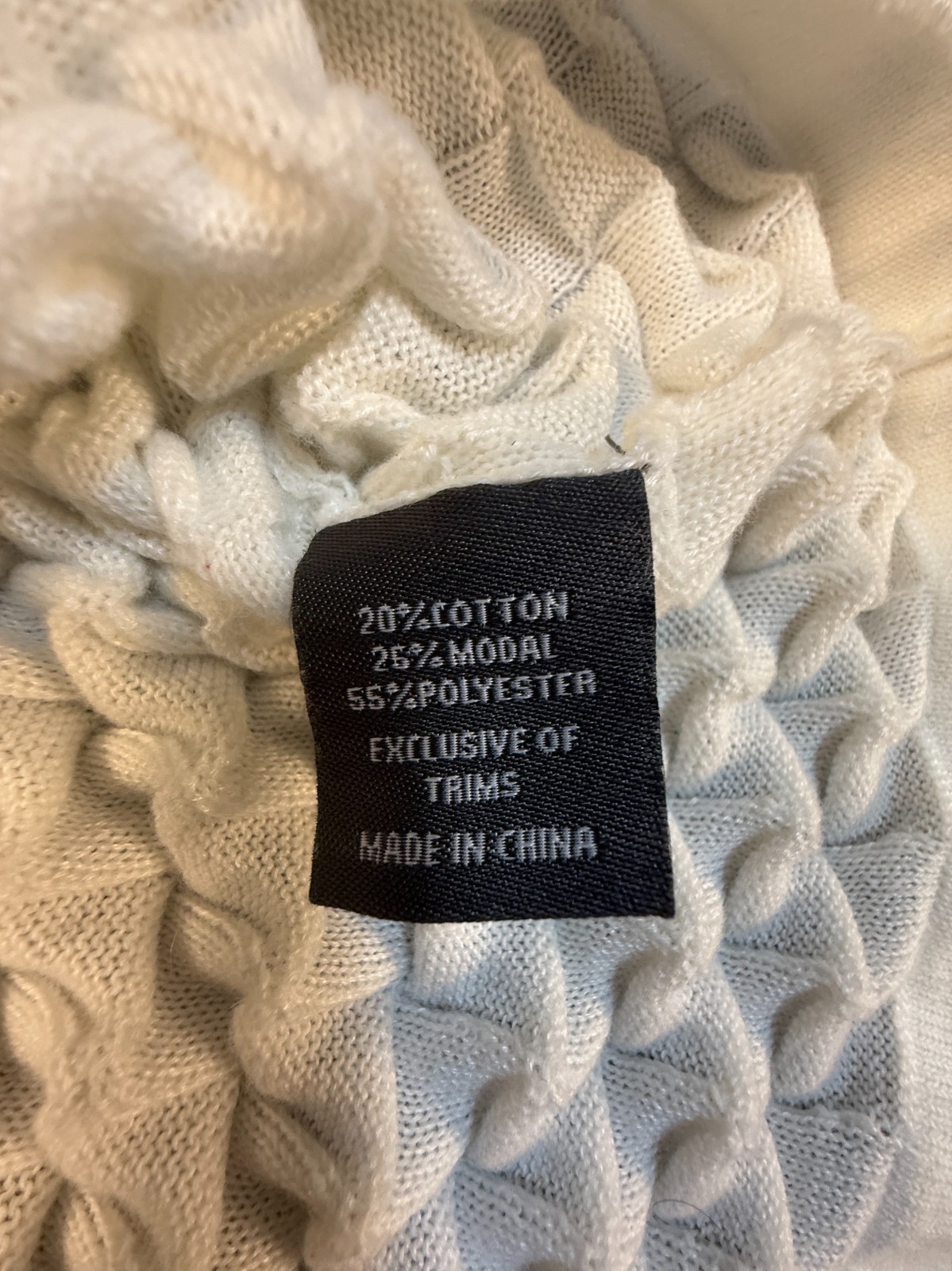 Silversilk textured knit with a raised geometric pattern; white XX (slim)