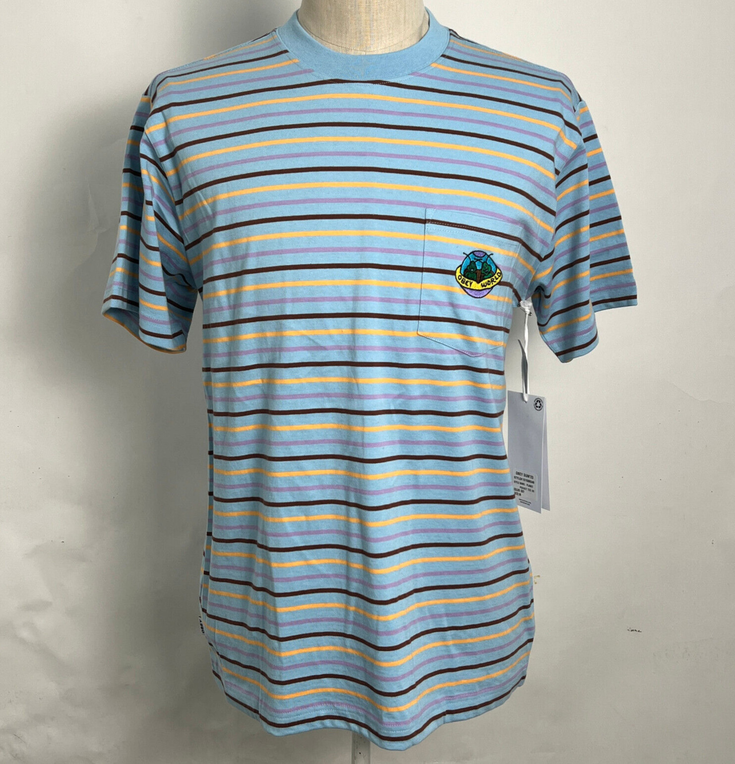 Obey Men’s Knit Pocket T-Shirt Planet Sky Blue/Multi Size M NWT Shepard Fairey
