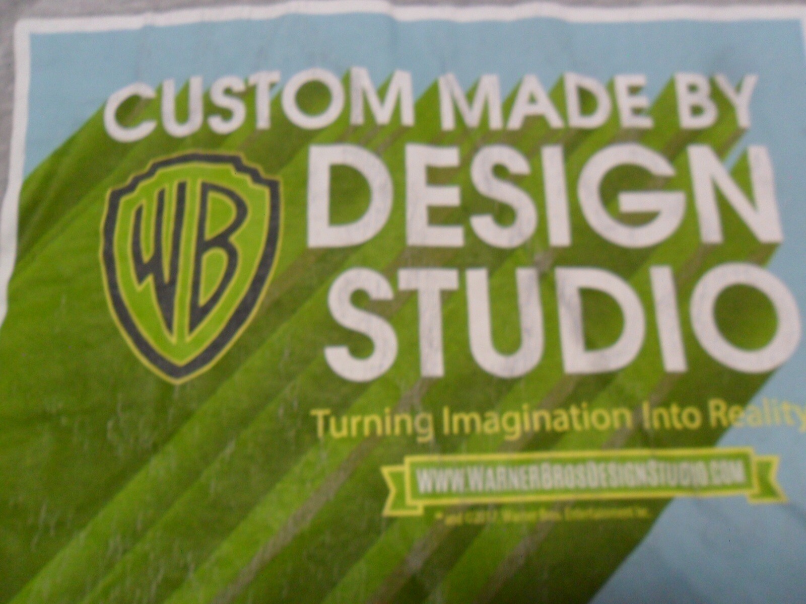 Small Warner Bros Design Studio Turning Imagination To Reality Damaged T Shirt