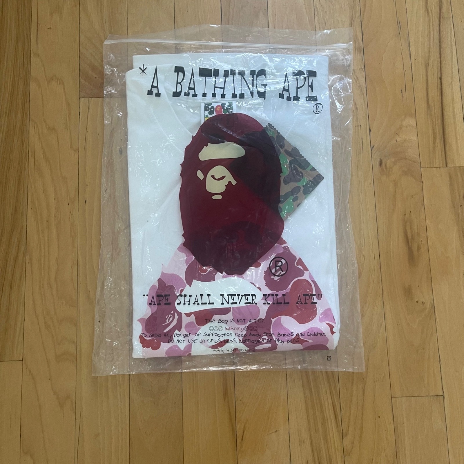 A Bathing Ape BAPE Men’s Small White Short Sleeve Crew Neck Ape Head Logo Tee