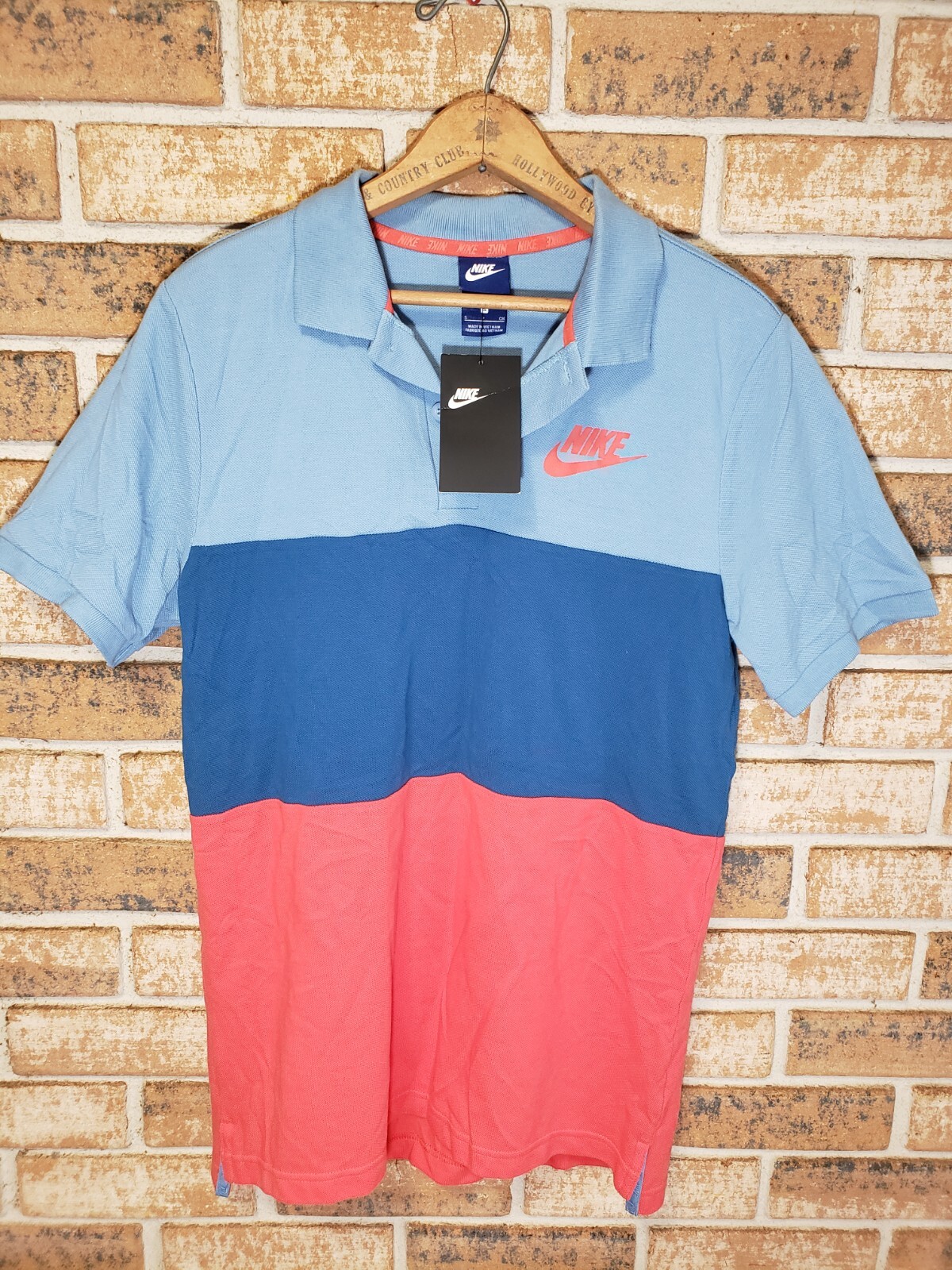 New with tag! Tri tone color Small Nike Polo shirt Blues And Red.