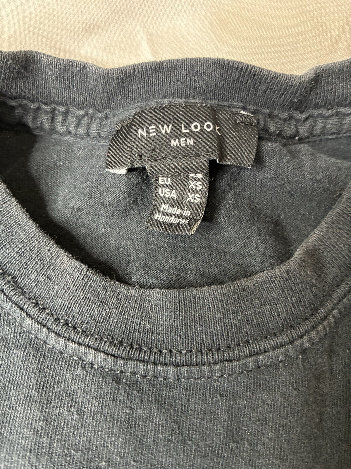 black T-shirt from New Look features a small “Tokyo Japan”