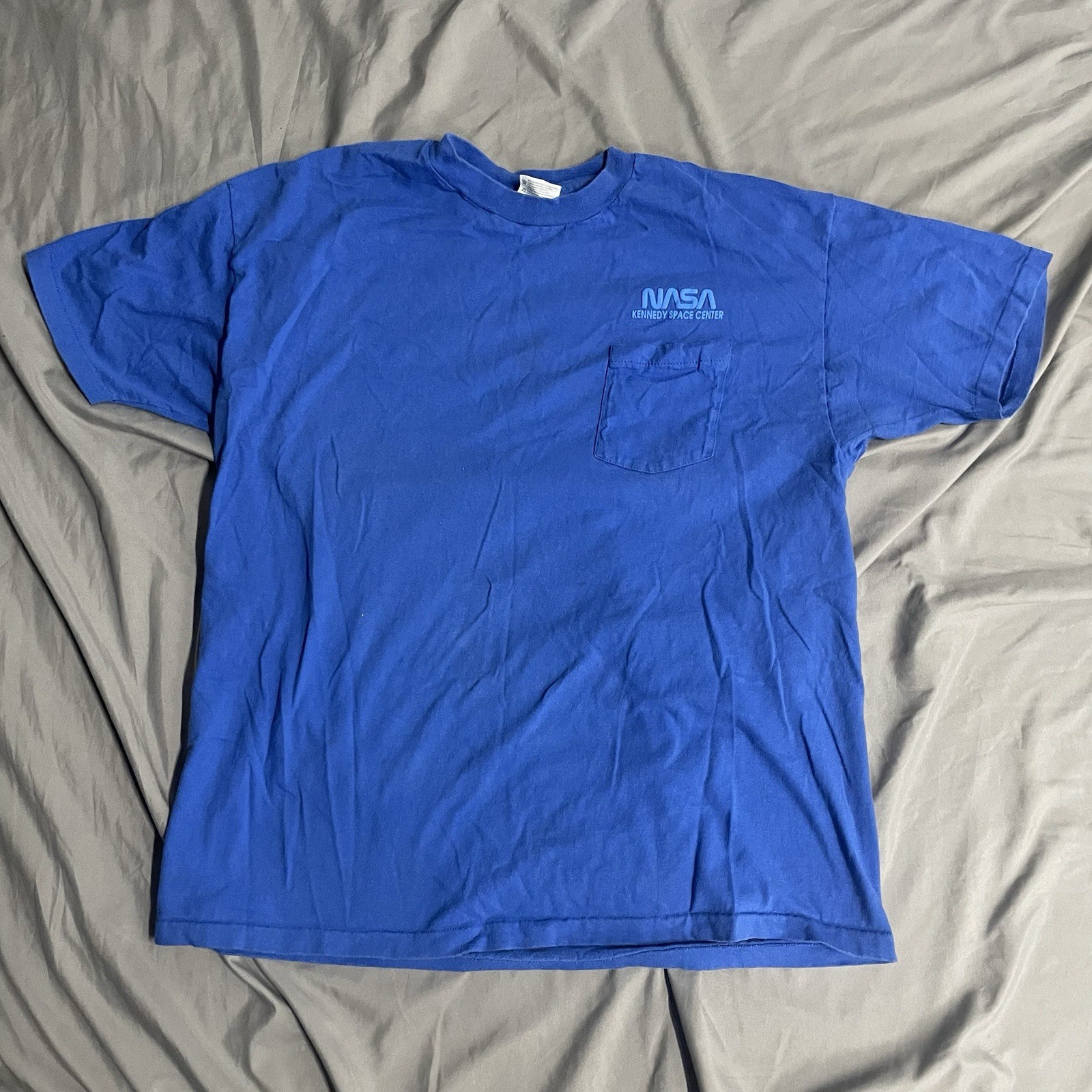 Vintage NASA Kennedy Space Center Blue Pocket T Shirt Size XL Made In USA Cotton