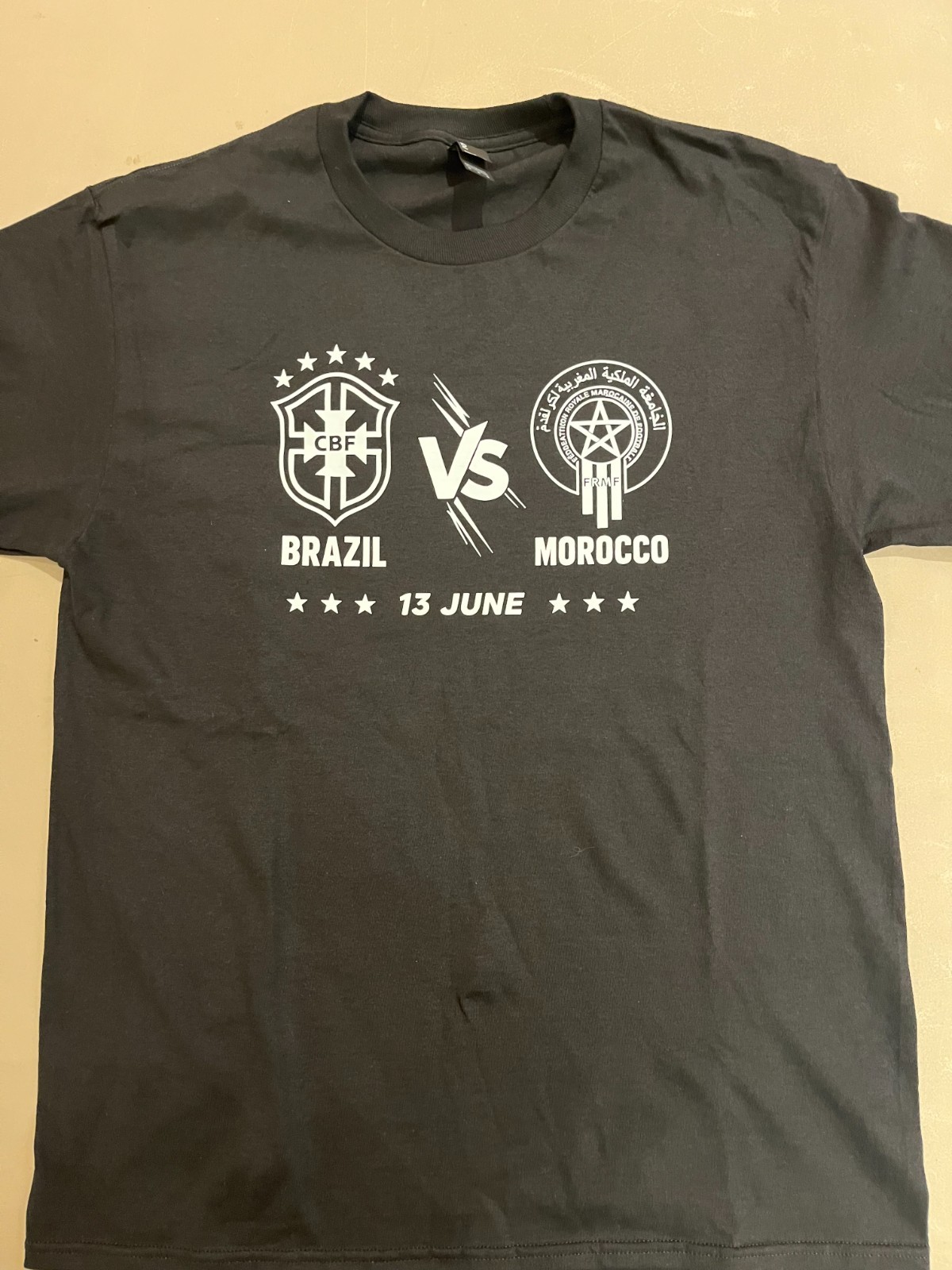 Get your Black & White Brazil vs Morocco T-shirt in M-L-XL while they LAST!