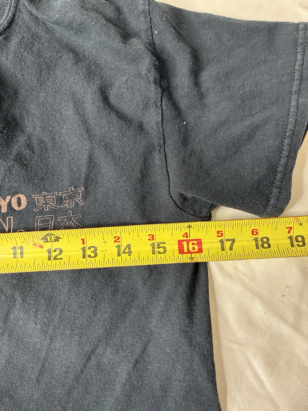 black T-shirt from New Look features a small “Tokyo Japan”