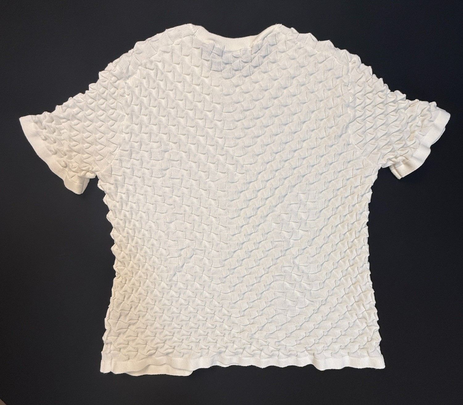 Silversilk textured knit with a raised geometric pattern; white XX (slim)